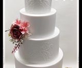 4 tier white stencilled wedding