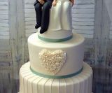 Family figures wedding cake